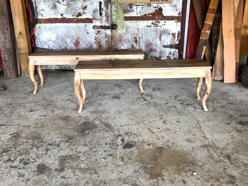 Two light brown benches